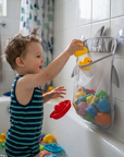 Mesh bath toy organizer bag on bathroom tiles – view 2