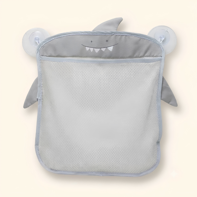 Mesh bath toy organizer bag on bathroom tiles